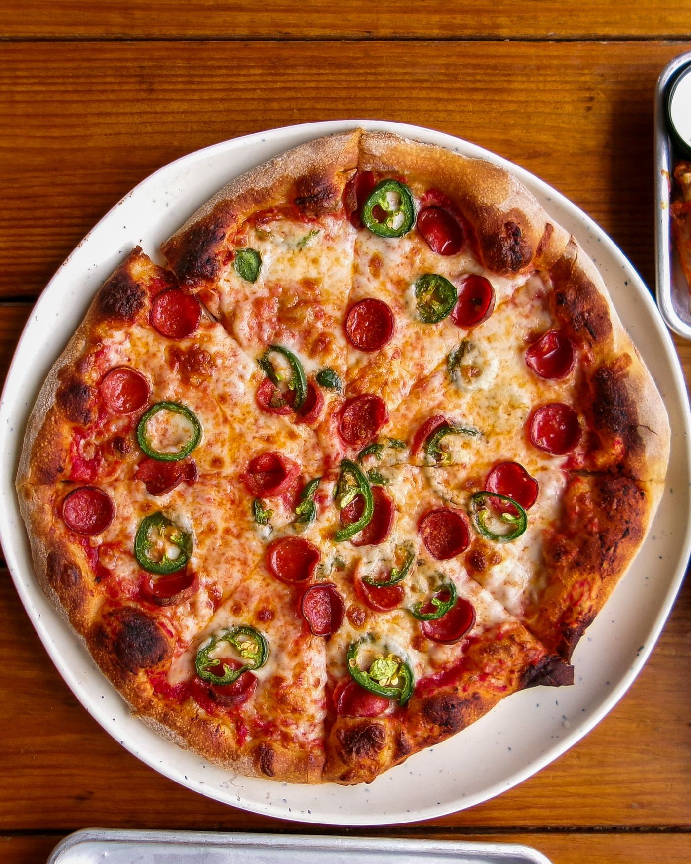 East Pizzeria signature pepperoni and jalapeño pizza